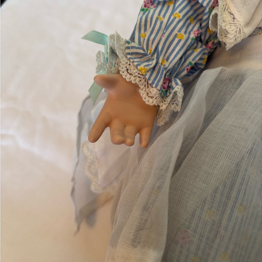 Charming Blue and White Porcelain Doll with Curly Hair - Picture 9 of 11